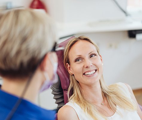 Patient smiling at a dentist.