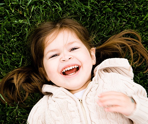 Little girl laughing after children's dentistry visit