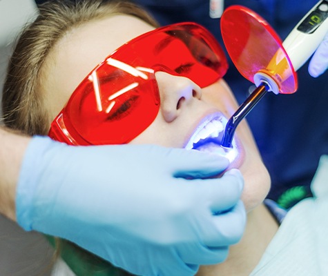 Patient receiving dental bonding treatment