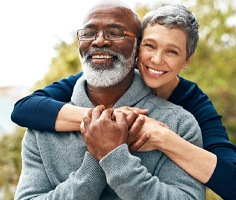 a mature couple smiling with dentures in Lancaster