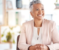  a professional woman smiling with dentures