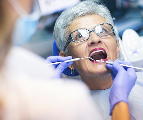 Patient receiving denture stabilization treatment