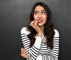 woman biting her fingernails