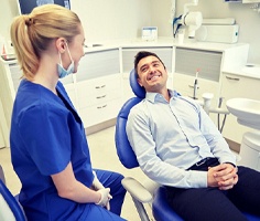 man at checkup with implant dentist in Lancaster