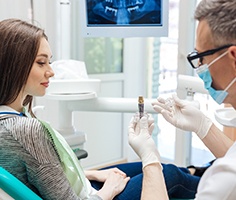 Lancaster implant dentist showing patient implant model