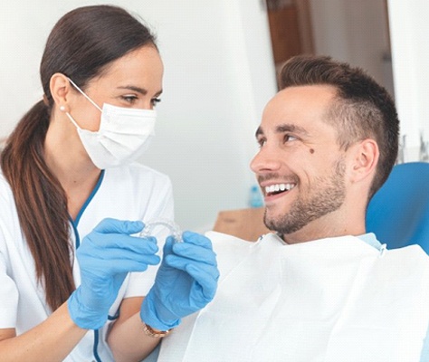 dentist and patient discussing Invisalign in Lancaster