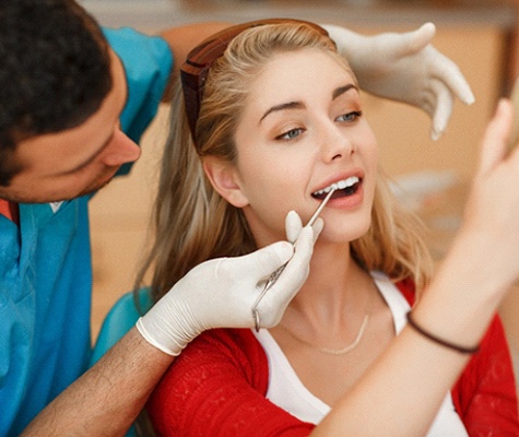 Woman receiving dental checkup in Lancaster