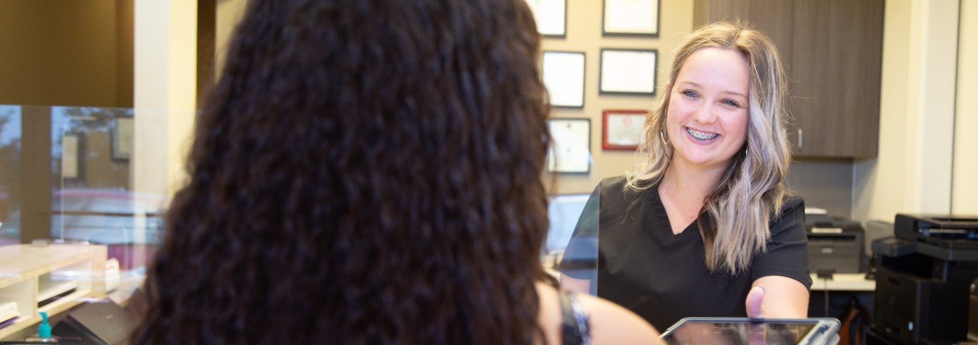 team member smiling at patient