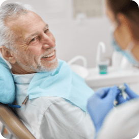 Dentist holding a set of full dentures