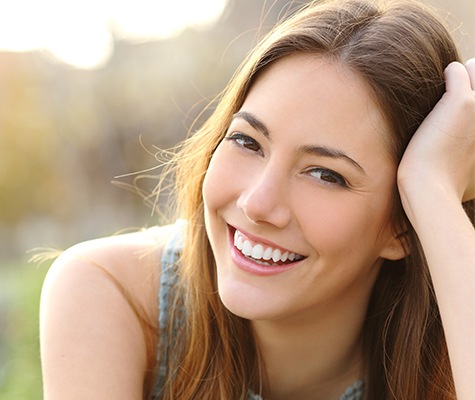 Woman sharing smile after tooth colored filling restoration