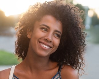 Woman with flawless smile after cosmetic dentistry