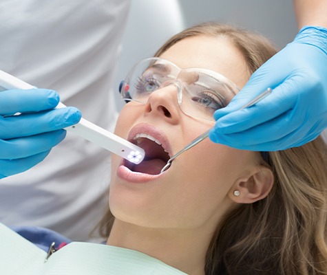 Dentist capturing smile photos with intraoral camera