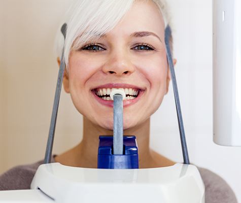 Woman receiving 3 D C T cone beam scanner