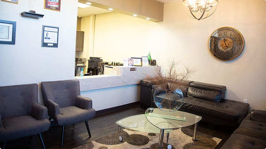 Couches, chairs, and glass table in waiting room