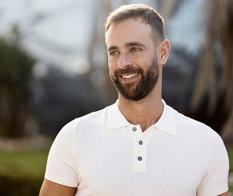 man smiling after getting veneers in Lancaster