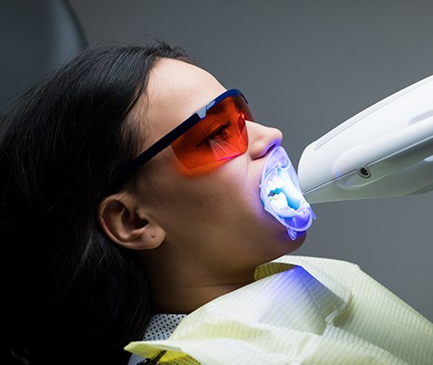 Patient receiving in office teeth whitening