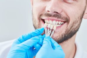 man getting veneers from his cosmetic dentist in Lancaster 