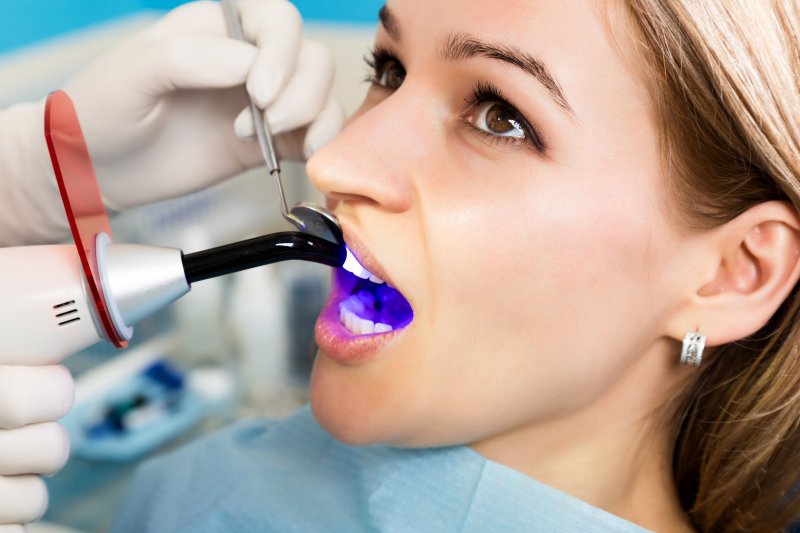 A woman receiving dental fillings