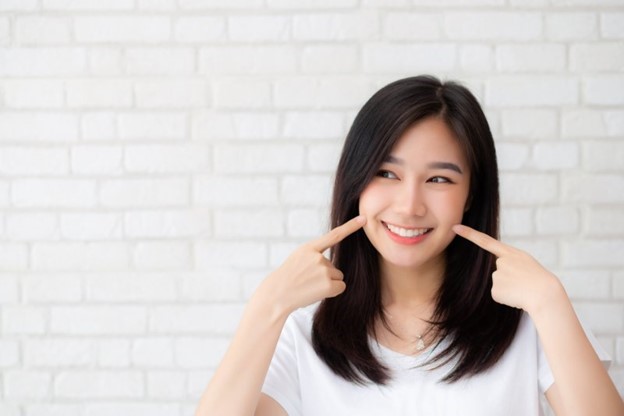 person with dental implants smiling