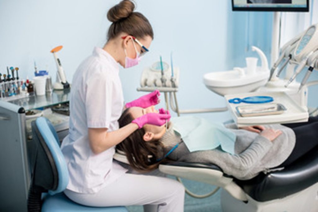 patient visiting dentist for tooth-colored filling