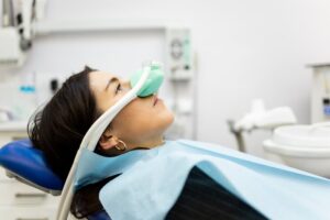 Woman getting nitrous oxide for her dental appointment
